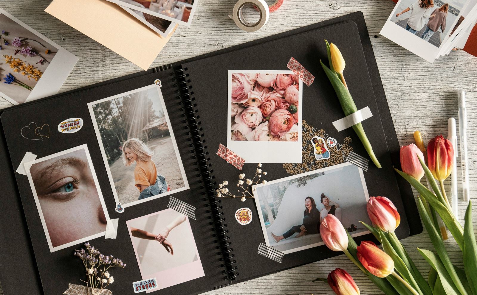 Scrapbook with polaroids and flowers